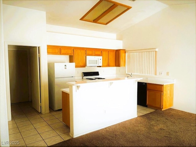 kitchen with white appliances, kitchen peninsula, a breakfast bar, lofted ceiling, and light tile patterned flooring