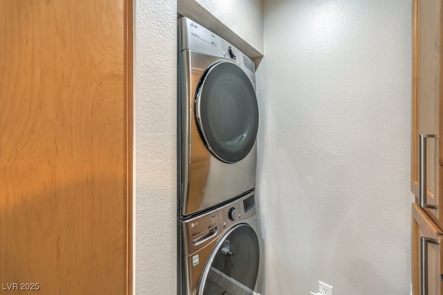 laundry room featuring stacked washer / dryer