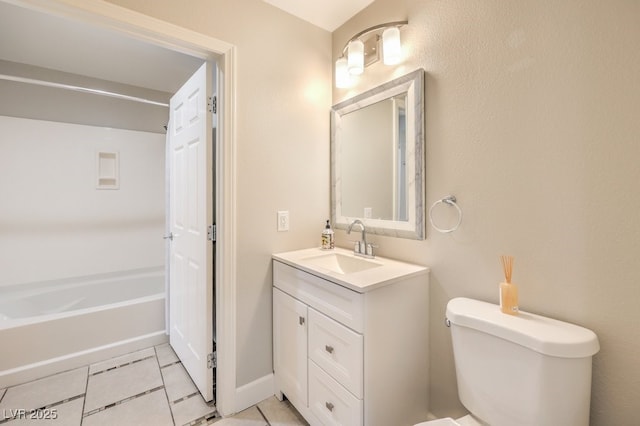 bathroom featuring tile patterned flooring, vanity, and toilet