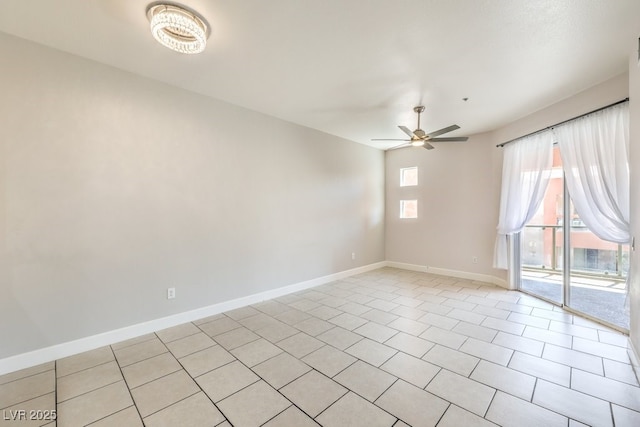 spare room with light tile patterned flooring and ceiling fan