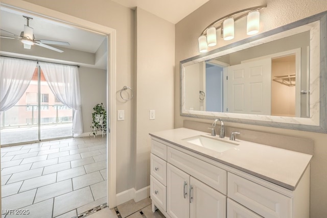 bathroom featuring ceiling fan, vanity, and tile patterned floors