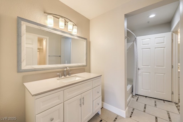 bathroom with bathing tub / shower combination, tile patterned flooring, and vanity