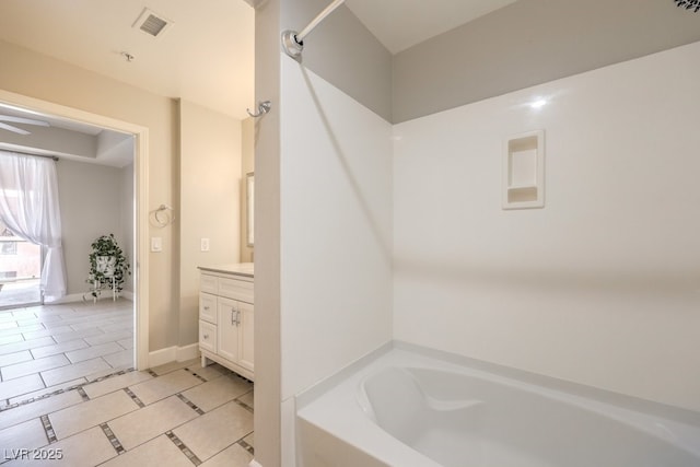 bathroom featuring tile patterned floors, vanity, and bathtub / shower combination