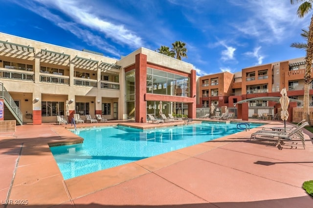 view of swimming pool with a patio area