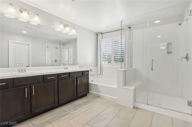 bathroom with vanity, tile patterned floors, and shower with separate bathtub