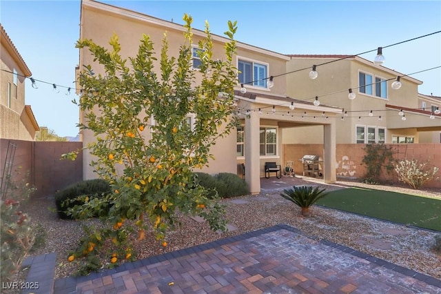 back of house with a patio area