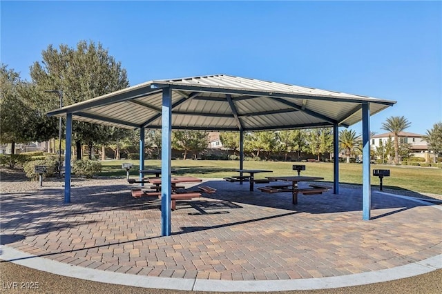 view of property's community with a gazebo and a yard