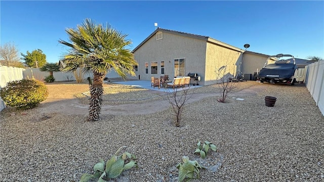 back of property with a patio