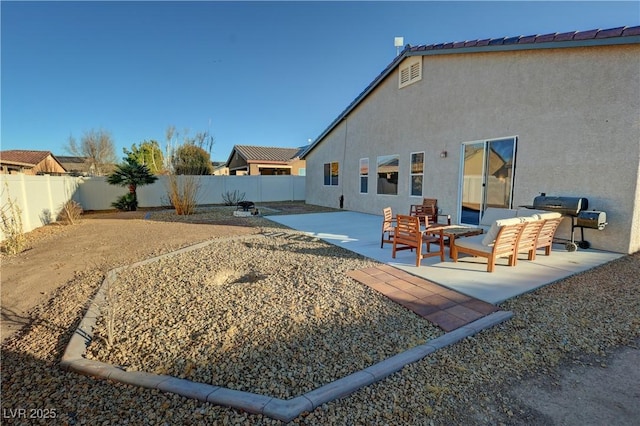 rear view of property with a patio area and outdoor lounge area