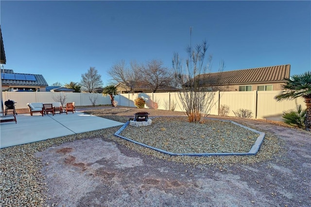 view of yard with a fire pit and a patio area