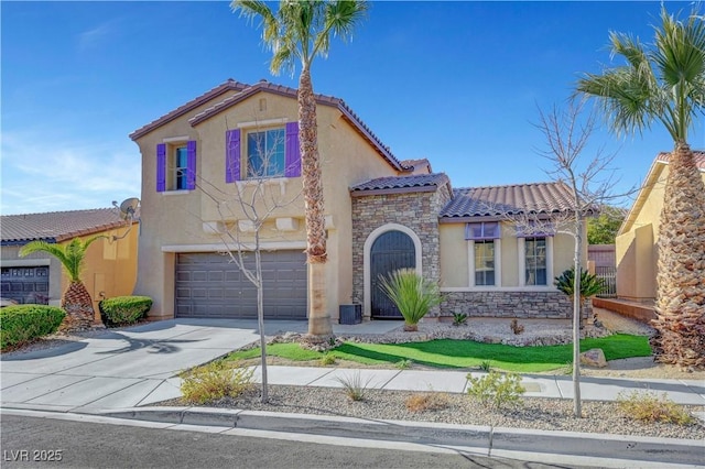 mediterranean / spanish-style home with a garage