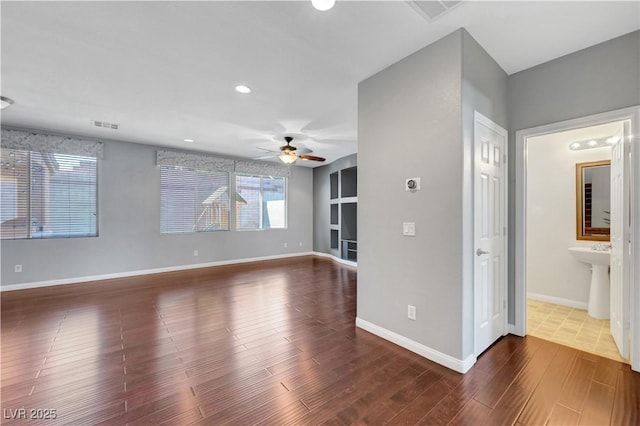 unfurnished living room featuring ceiling fan