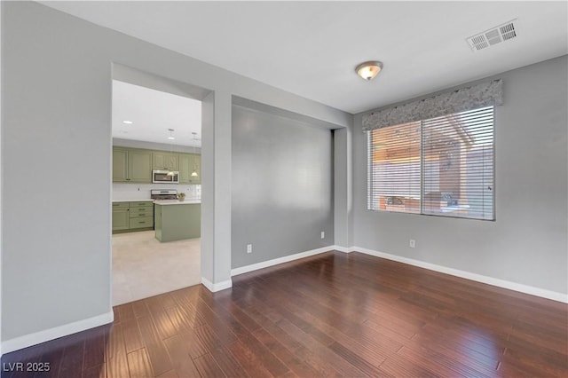 unfurnished room featuring dark wood-type flooring