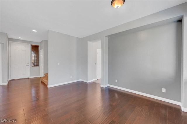 unfurnished room featuring dark hardwood / wood-style floors