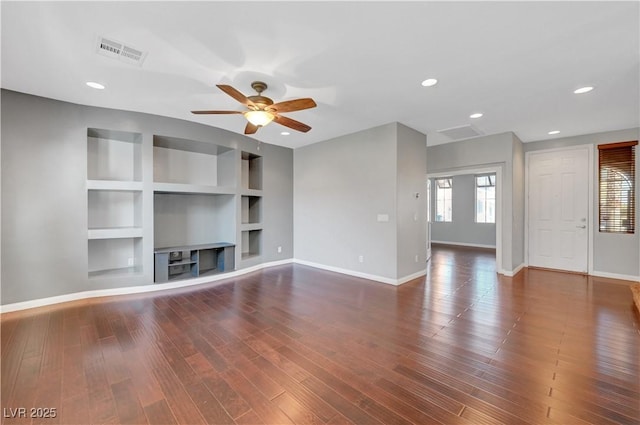 unfurnished living room featuring built in features, ceiling fan, and dark hardwood / wood-style flooring