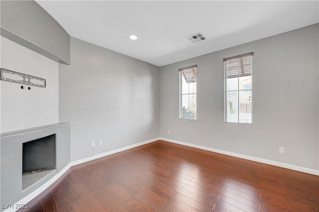 unfurnished living room featuring hardwood / wood-style flooring