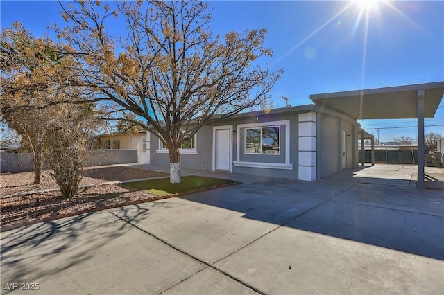 view of front of property with a carport