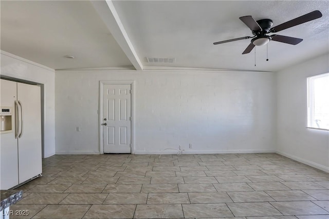 tiled spare room featuring beam ceiling and ceiling fan