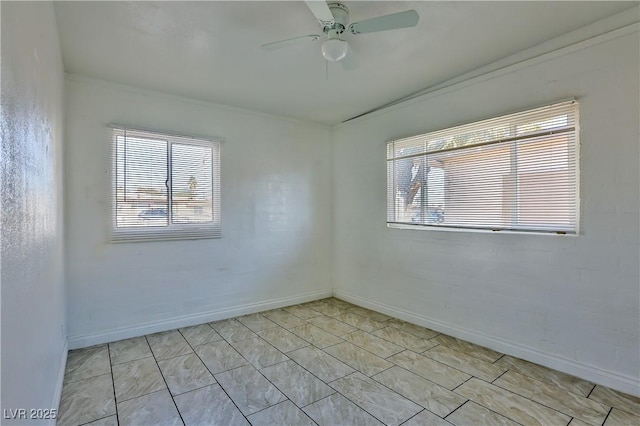 unfurnished room with ceiling fan and crown molding