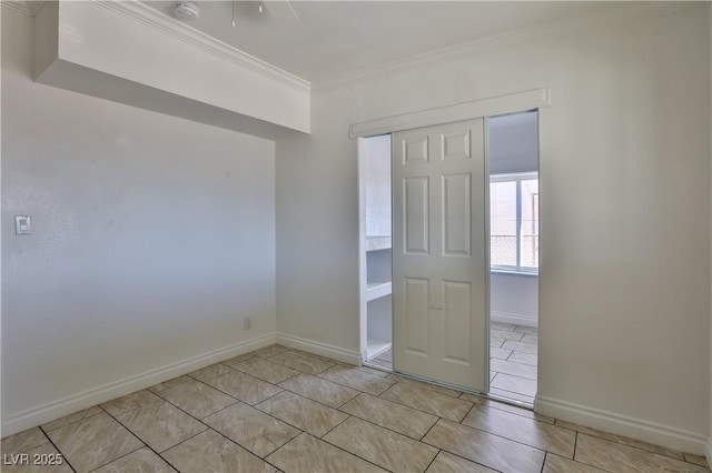 tiled empty room with crown molding