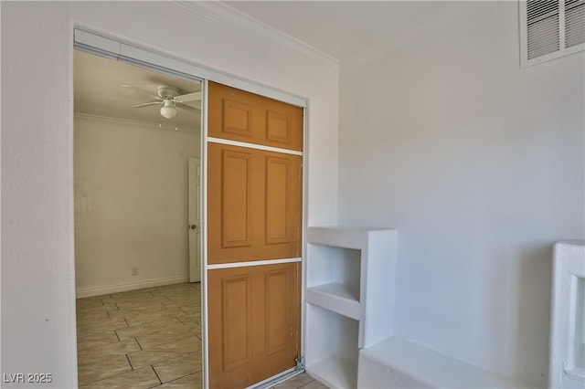 entrance to property with ceiling fan