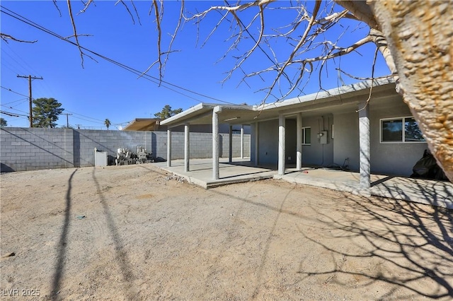 rear view of property with a patio area