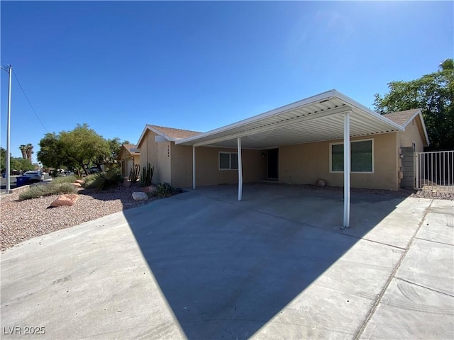 rear view of property featuring a carport