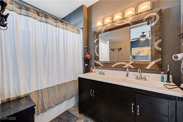 bathroom featuring ceiling fan, shower / bath combination with curtain, and vanity