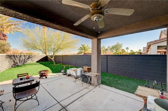 view of patio featuring a fire pit and ceiling fan