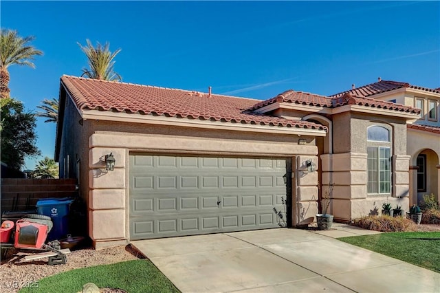 mediterranean / spanish-style home featuring a garage