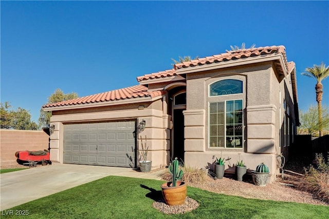 mediterranean / spanish-style house with a garage