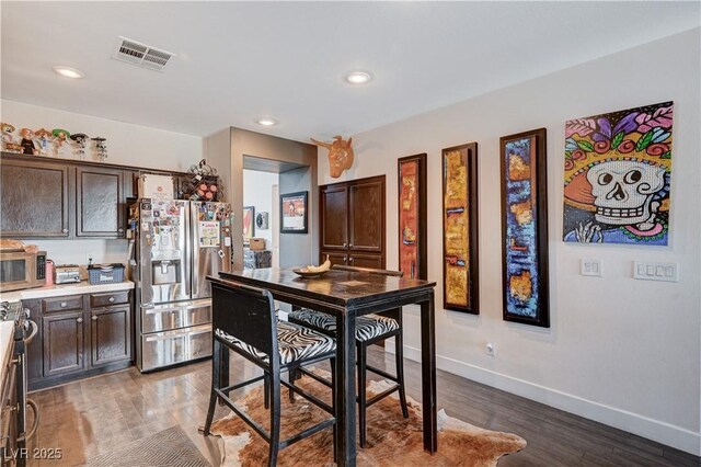 dining space featuring hardwood / wood-style flooring