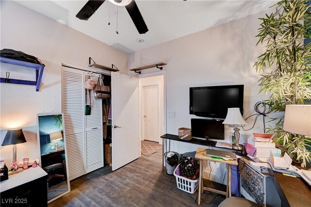 office space with dark wood-type flooring and ceiling fan