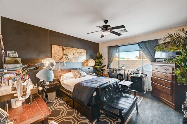 bedroom with ceiling fan and hardwood / wood-style floors