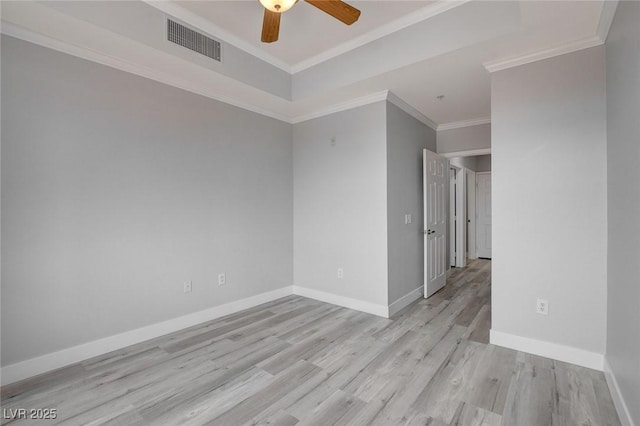 spare room with ornamental molding, ceiling fan, and light wood-type flooring