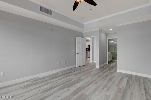 unfurnished room featuring ceiling fan, light hardwood / wood-style floors, and crown molding