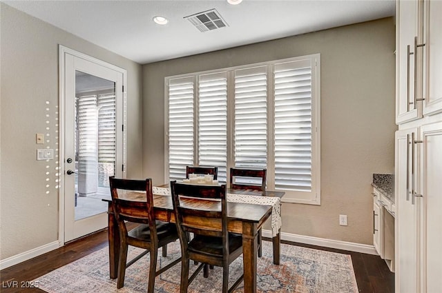 dining room with dark wood-type flooring