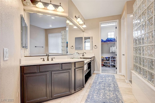 bathroom featuring tile patterned flooring and vanity