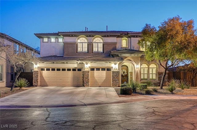 mediterranean / spanish house featuring a garage