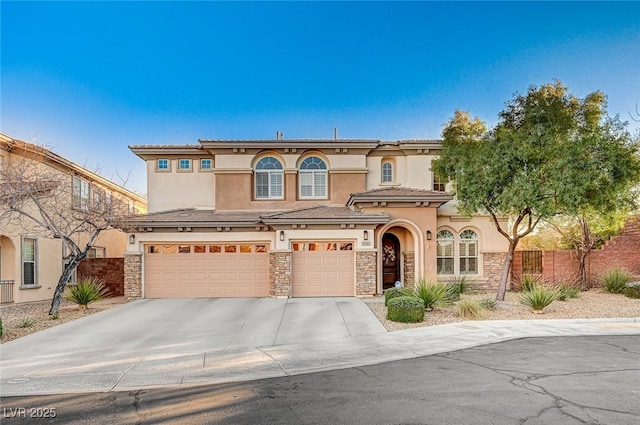 mediterranean / spanish-style house with a garage