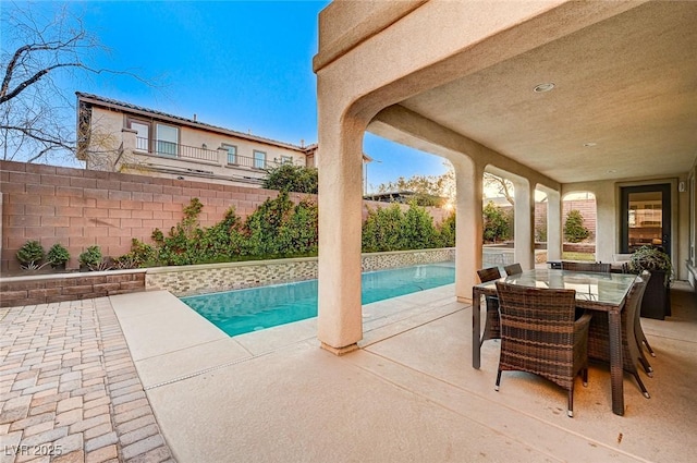 view of swimming pool with a patio area