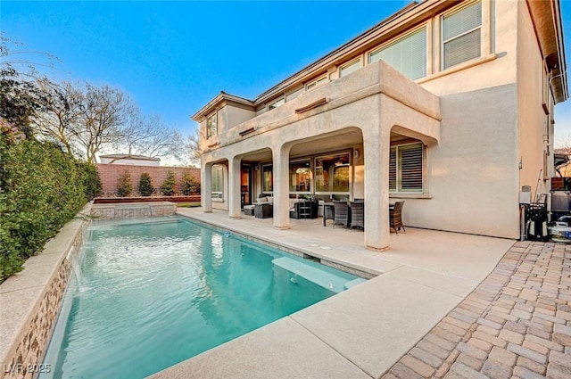 view of pool featuring a patio and pool water feature