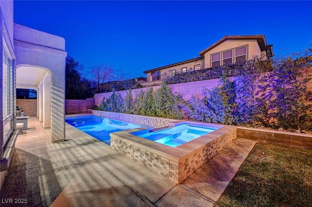 view of swimming pool with a patio area and an in ground hot tub