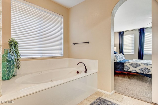 bathroom featuring a bath and tile patterned flooring