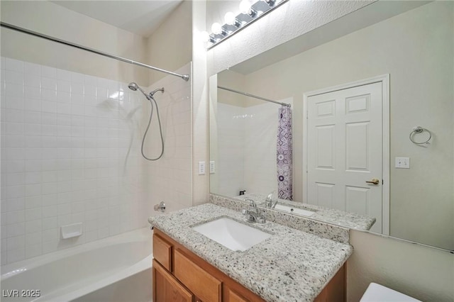 bathroom featuring shower / bath combination with curtain and vanity