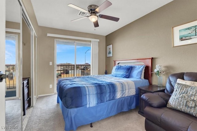 carpeted bedroom with ceiling fan and access to outside