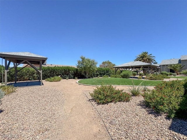 view of home's community featuring a gazebo and a yard