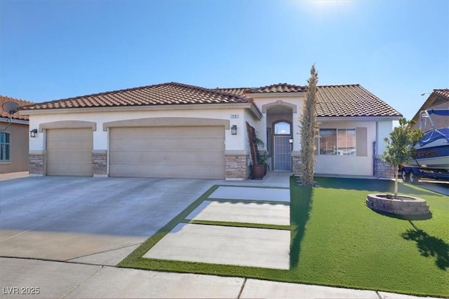 mediterranean / spanish-style house featuring a garage and a front lawn