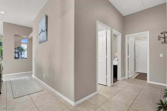 hallway featuring light tile patterned flooring