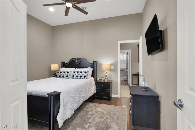 bedroom with ceiling fan and dark hardwood / wood-style floors